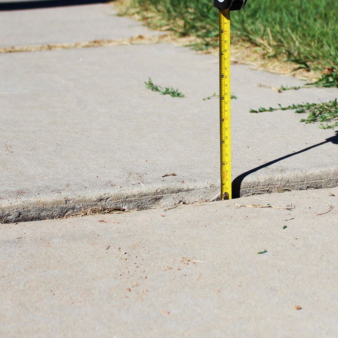 Tape measuring an uneven concrete slab